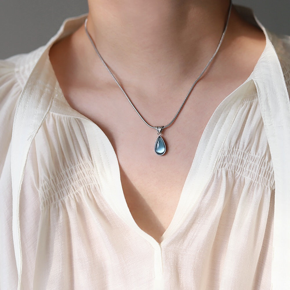 Gold-Plated Teardrop Pendant Necklace with Blue Synthetic Cat Eye Stone