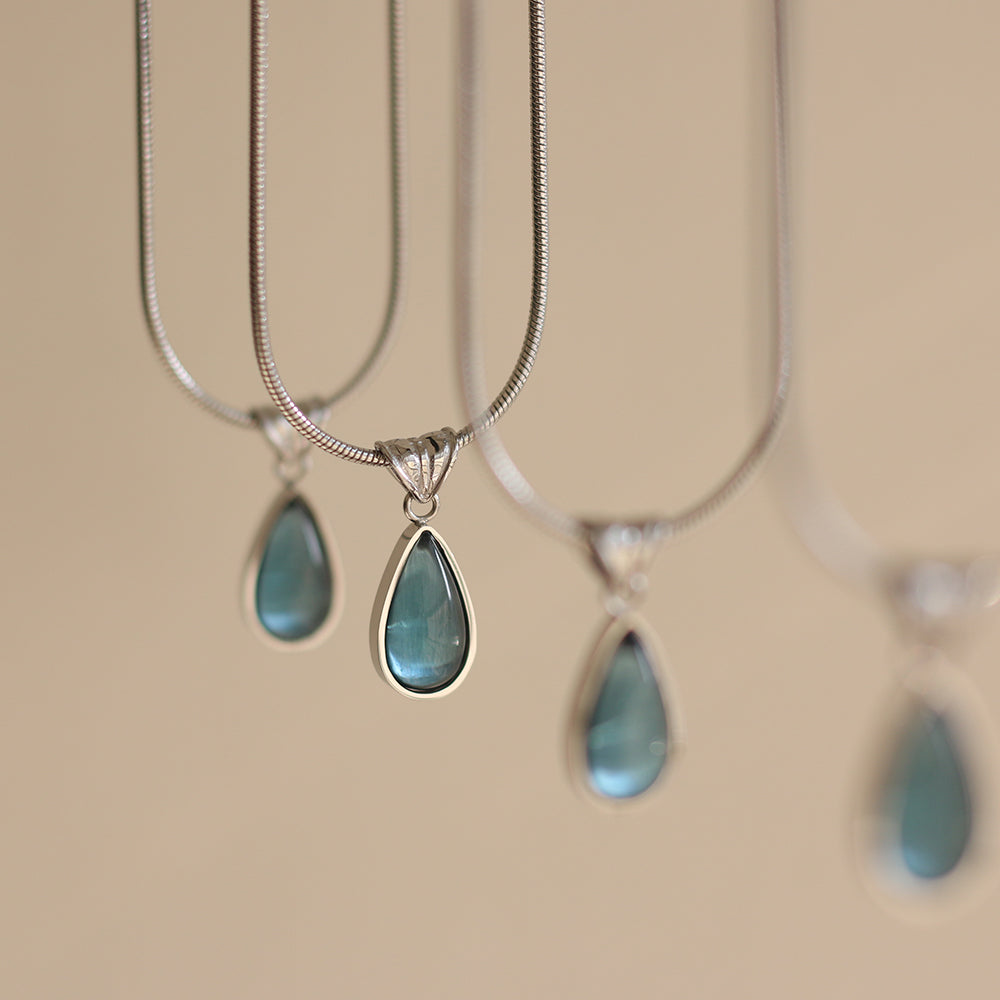 Gold-Plated Teardrop Pendant Necklace with Blue Synthetic Cat Eye Stone