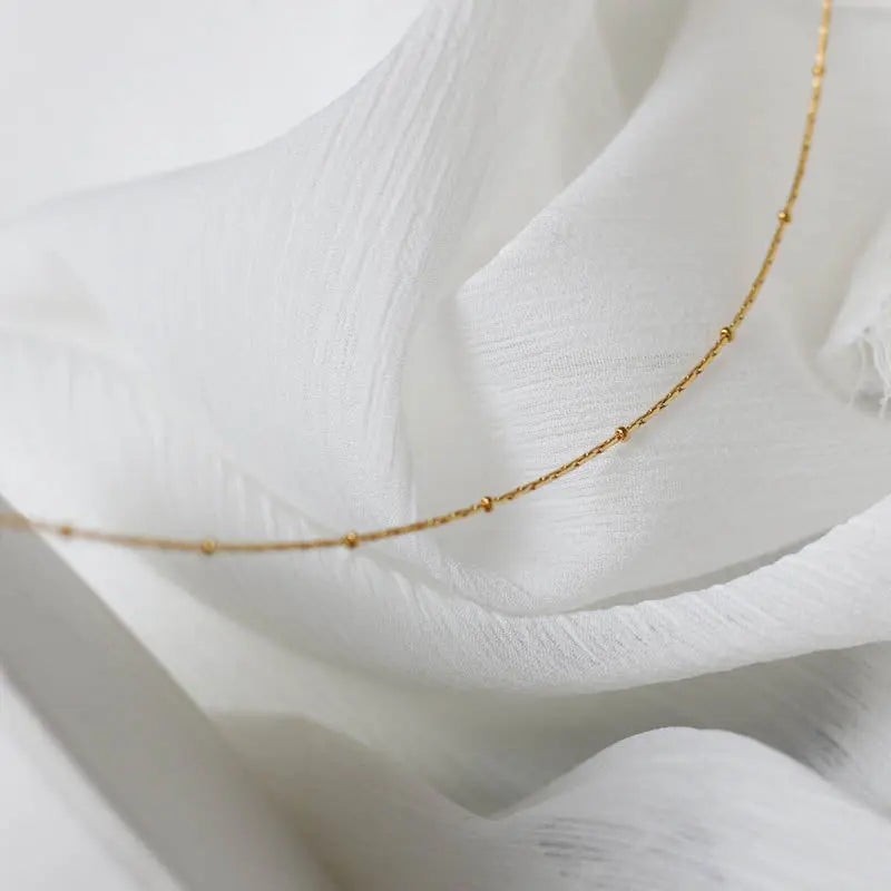 Layered Gold Plated Necklace with Coin Charm & Emerald Angel Pendant Crushes.