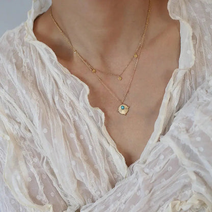 Bohemian Double Layer Necklace in 18K Gold Plated Titanium Steel with Artificial Turquoise Pendant Crushes.